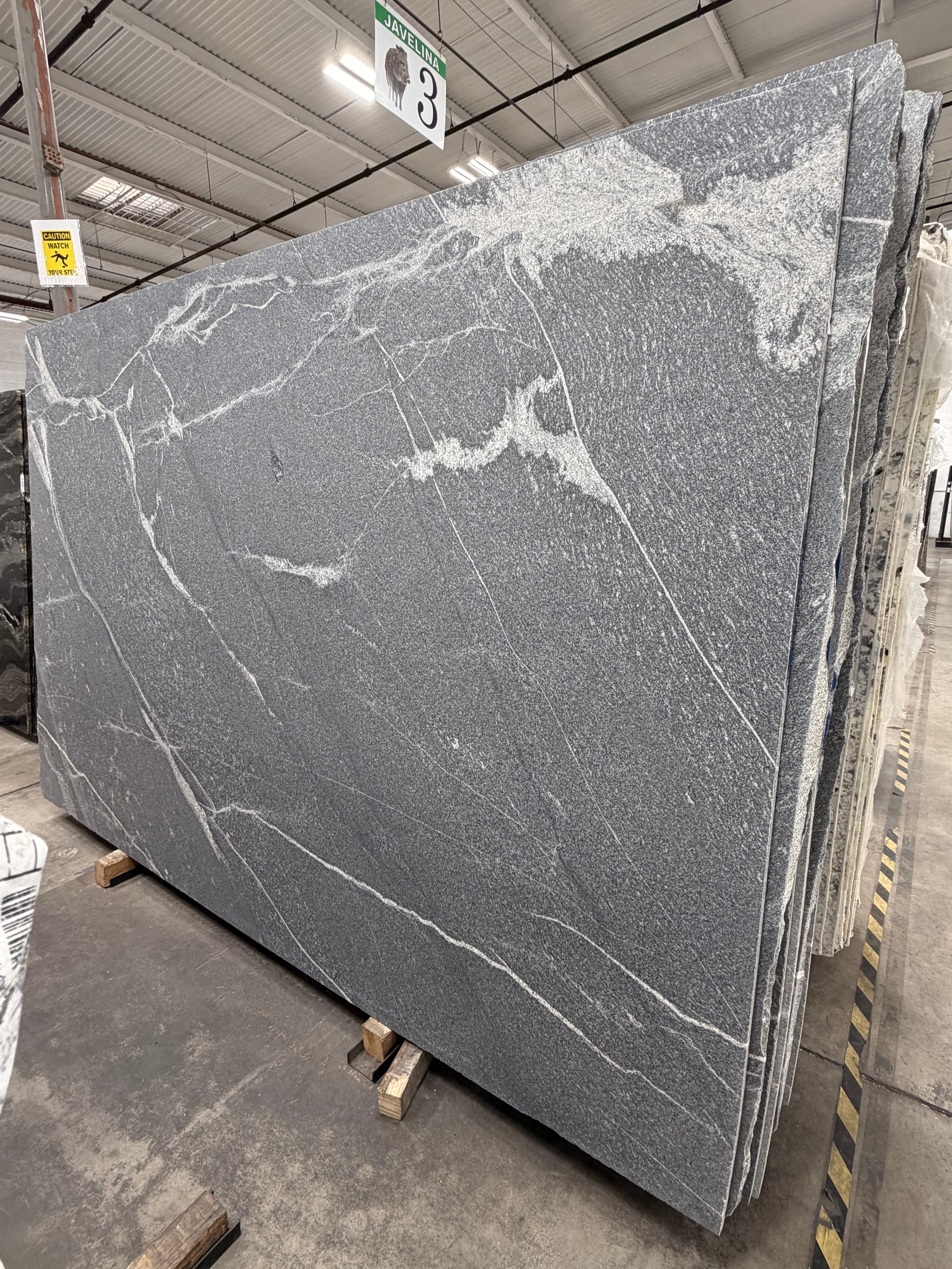 Silver Grey Honed 2cm slab on the floor at our Sherman St yard